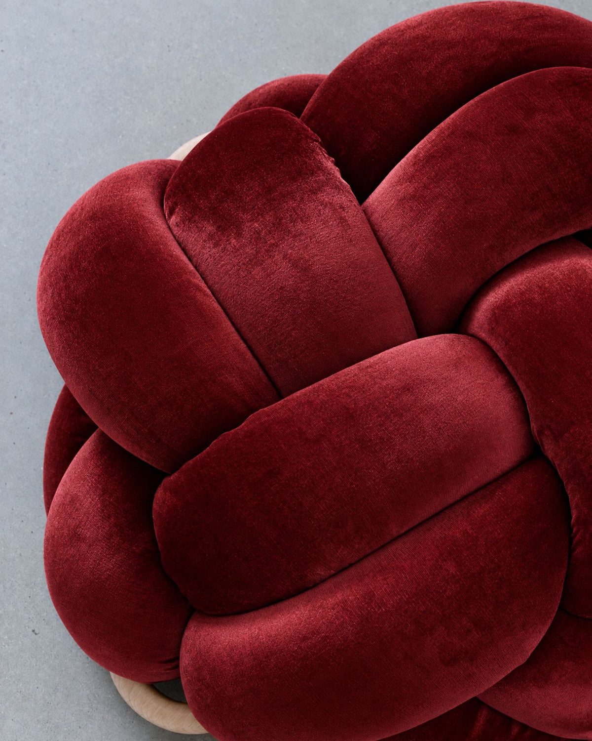 Close-up of smooth maroon velvet knot braids