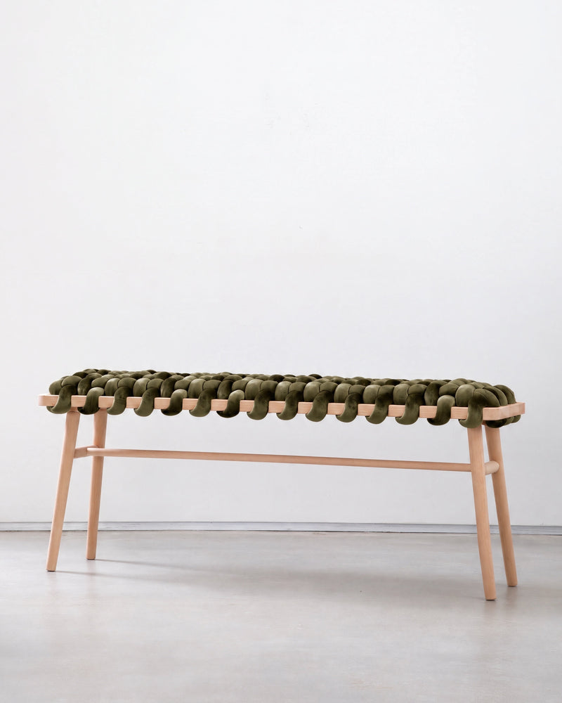 47 inch olive green velvet woven bench with a beechwood frame against a white wall