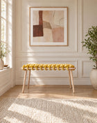37 inch yellow velvet woven bench under a framed abstract artwork in a panelled room