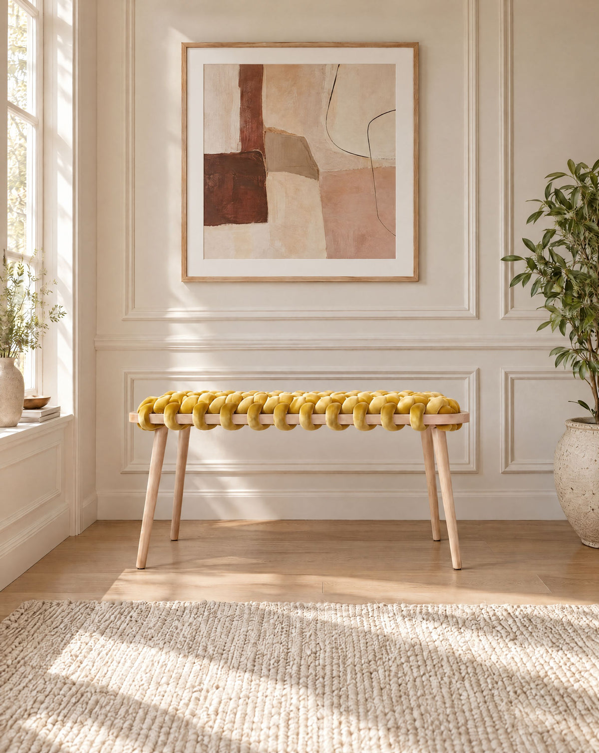37 inch yellow velvet woven bench under a framed abstract artwork in a panelled room