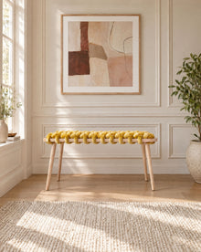 37 inch yellow velvet woven bench under a framed abstract artwork in a panelled room