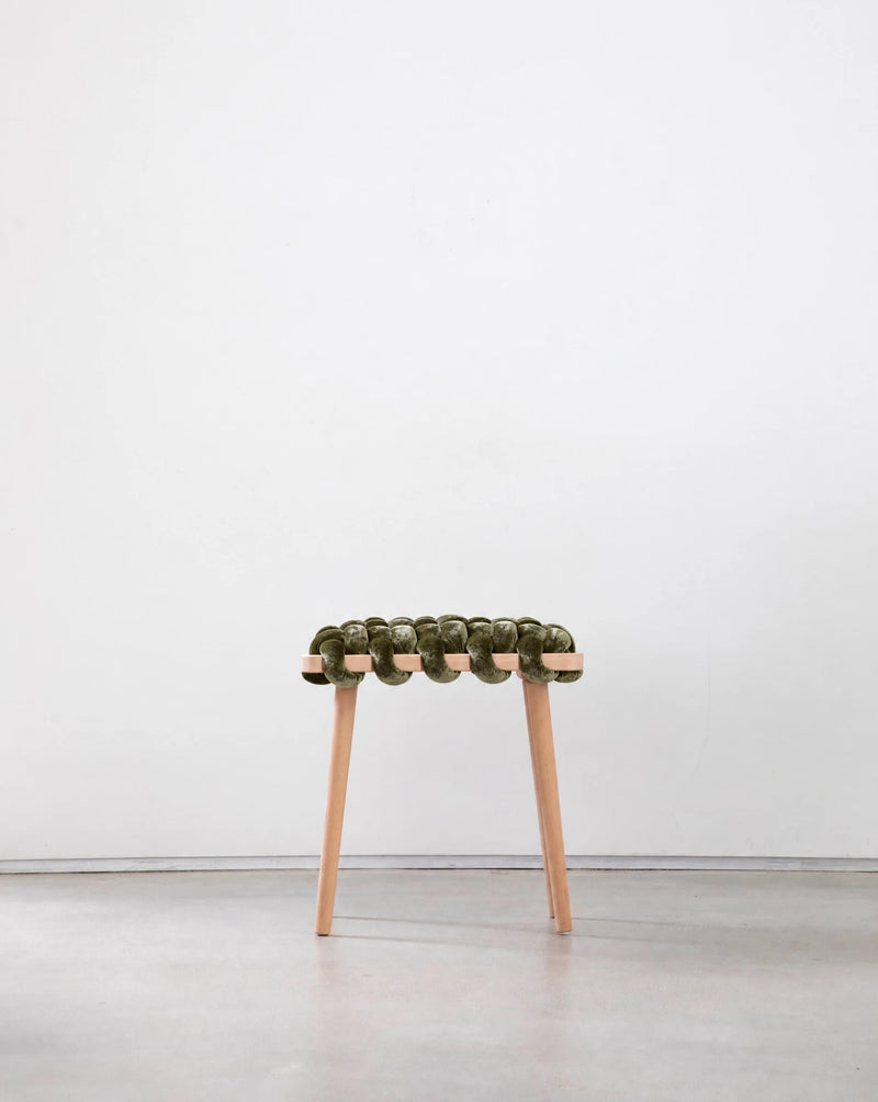 Olive green velvet woven stool with a beechwood frame, front view