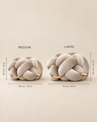 Knot Ottoman size guide: Medium 55 cm / 22 in wide, 35 cm / 14 in high; Large 75 cm / 30 in wide, 40 cm / 15.5 in high