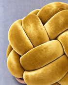 Close-up of the sunlight yellow velvet knots and wooden ring