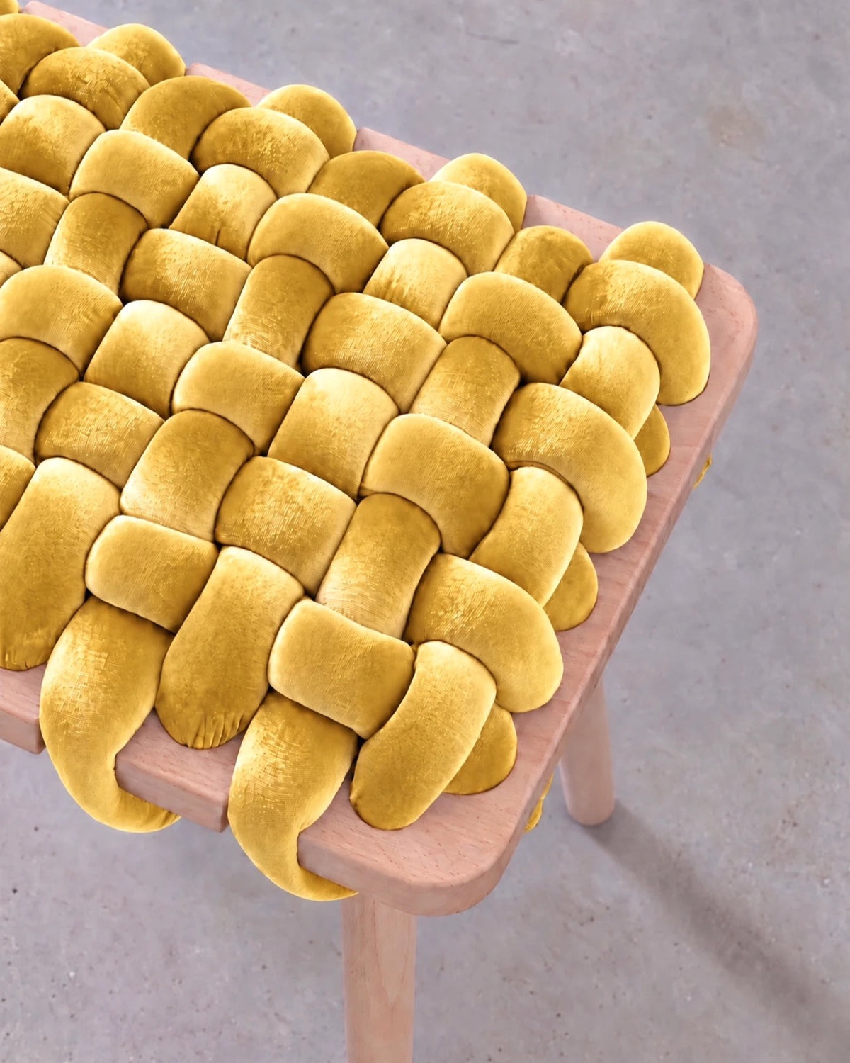 Close-up of the mustard yellow velvet woven seat